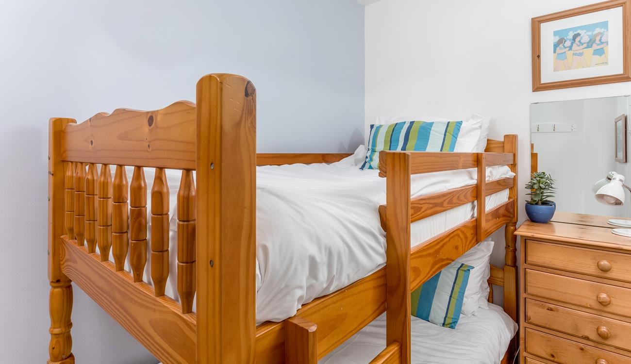 Tuck the kids into bed, exhausted from spending days at the beach.