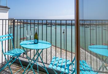 Open a bottle of wine to sip on the balcony on a sunny afternoon.