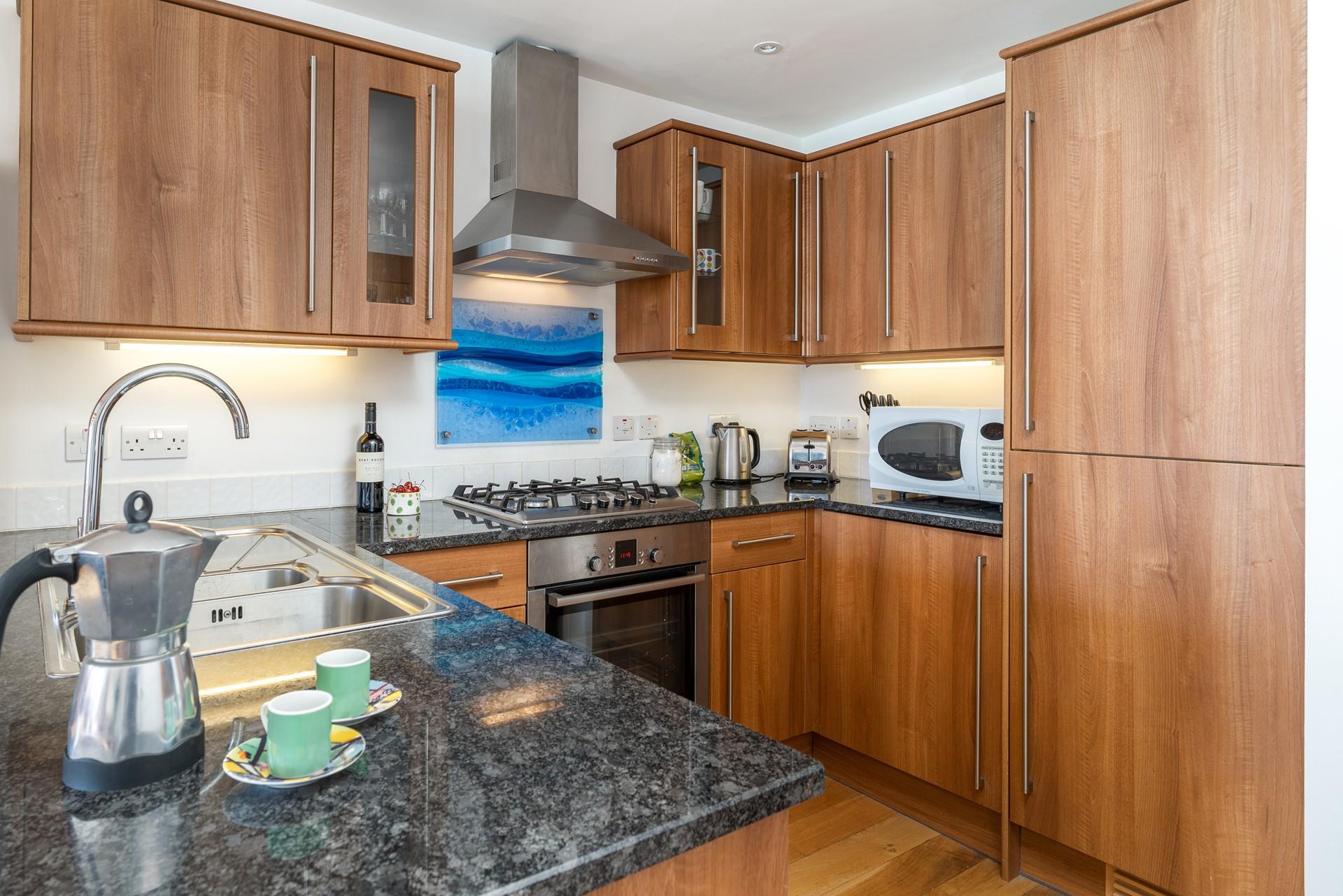 The kitchen is well-equipped for cooking up delightful meals.