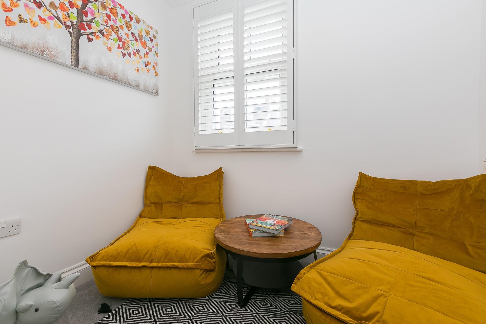 The separate snug room is great for the kids to play in while the adults enjoy some drinks in the living room.