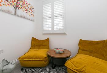 The separate snug room is great for the kids to play in while the adults enjoy some drinks in the living room.