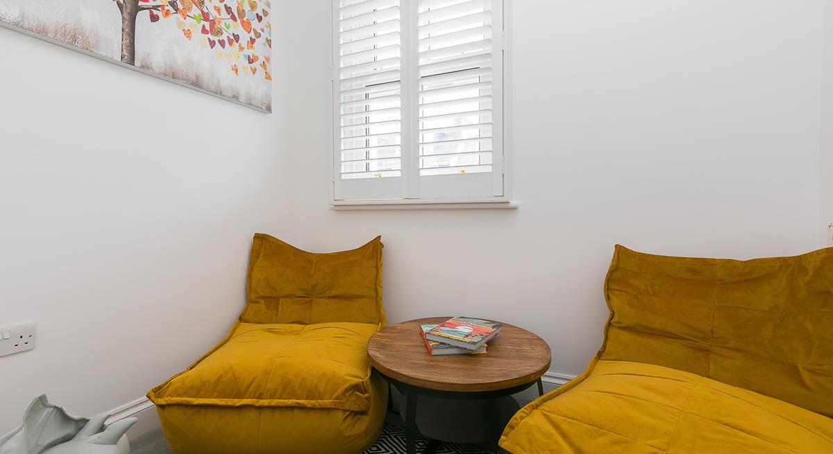 The separate snug room is great for the kids to play in while the adults enjoy some drinks in the living room.