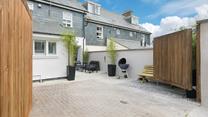 This house offers privacy with the double gates, so you can spend evenings outside soaking up the last of the sun.