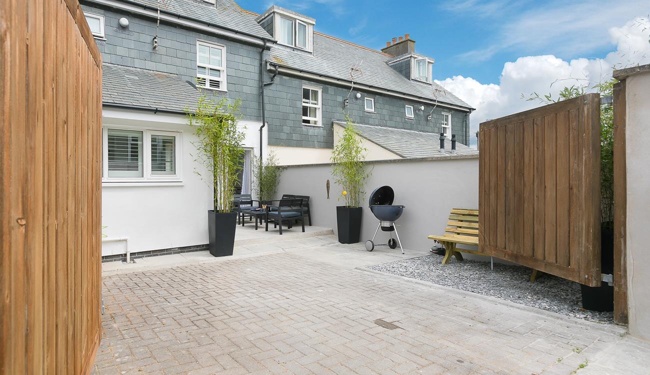 This house offers privacy with the double gates, so you can spend evenings outside soaking up the last of the sun.