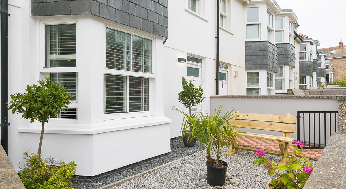 Sip your morning coffee on the bench and decide what's on your day's agenda.