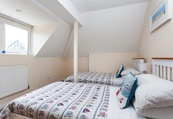 Bedroom 2 has twin beds perfect for kids or adults to enjoy a restful night's slumber.