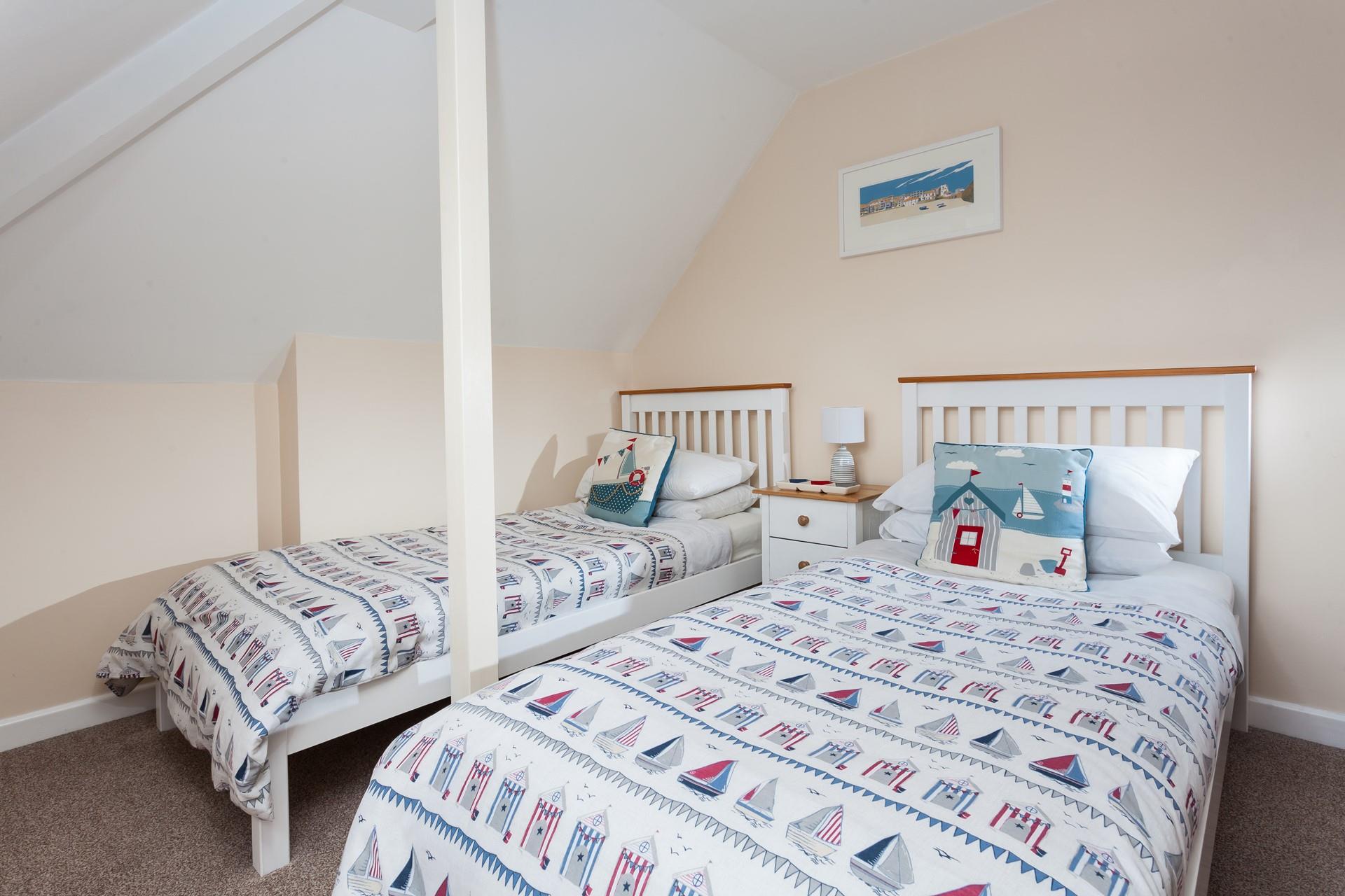 The twin room is decorated with a seaside theme.