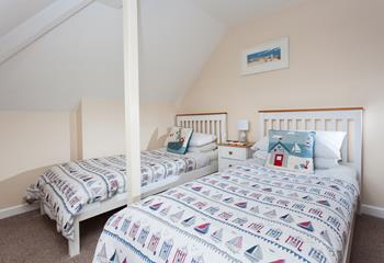 The twin room is decorated with a seaside theme.