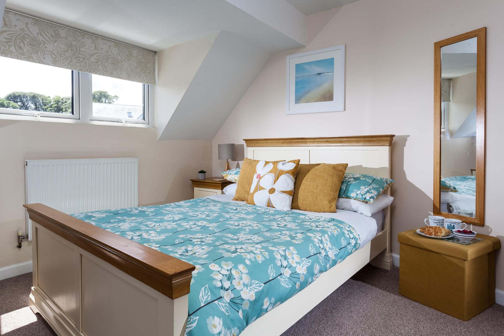 Snuggle into the spacious double bed and drift off to sleep.
