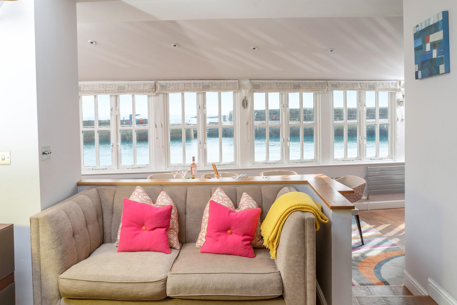 With harbour views from the kitchen, enjoy coastal, open plan living.