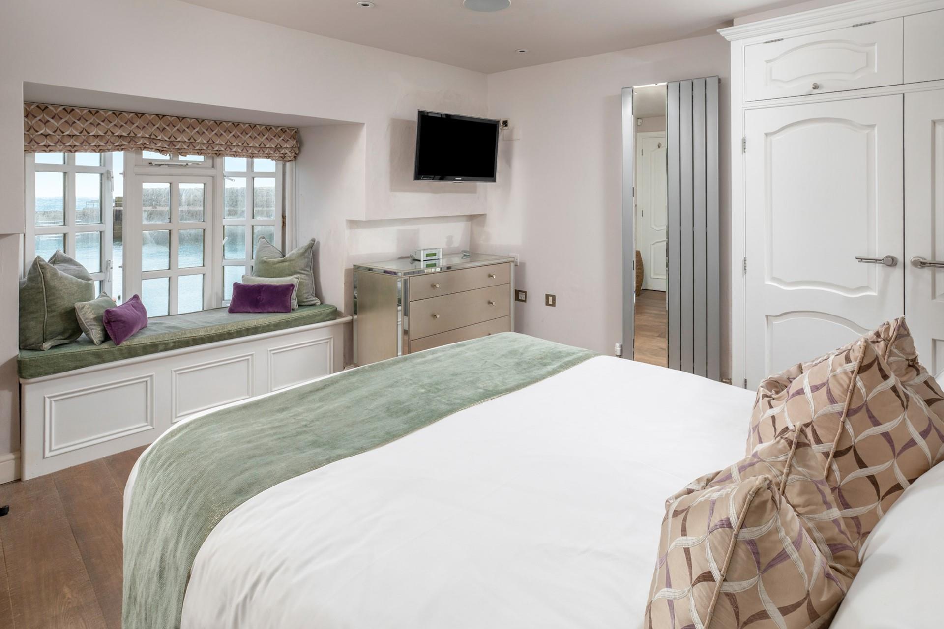 Grab a book from the office and curl up on the window seat, or simply admire the view.