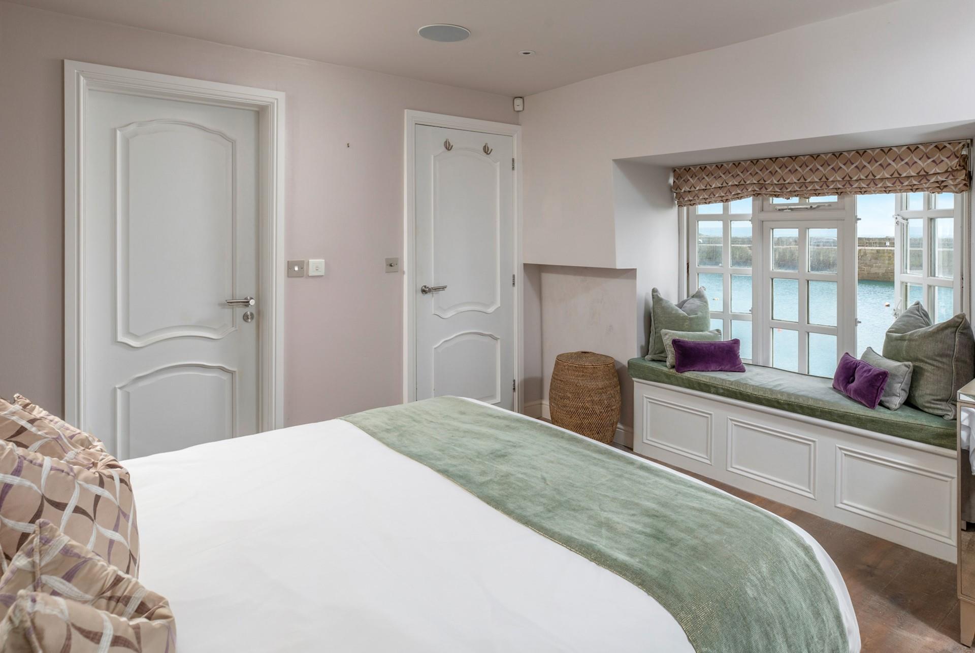 The harbour views continue in the king size bedroom.