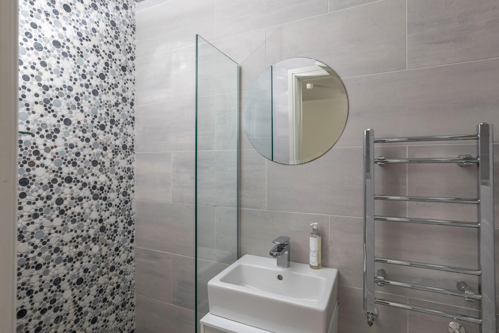 Rinse off in one of the three rainfall showers.