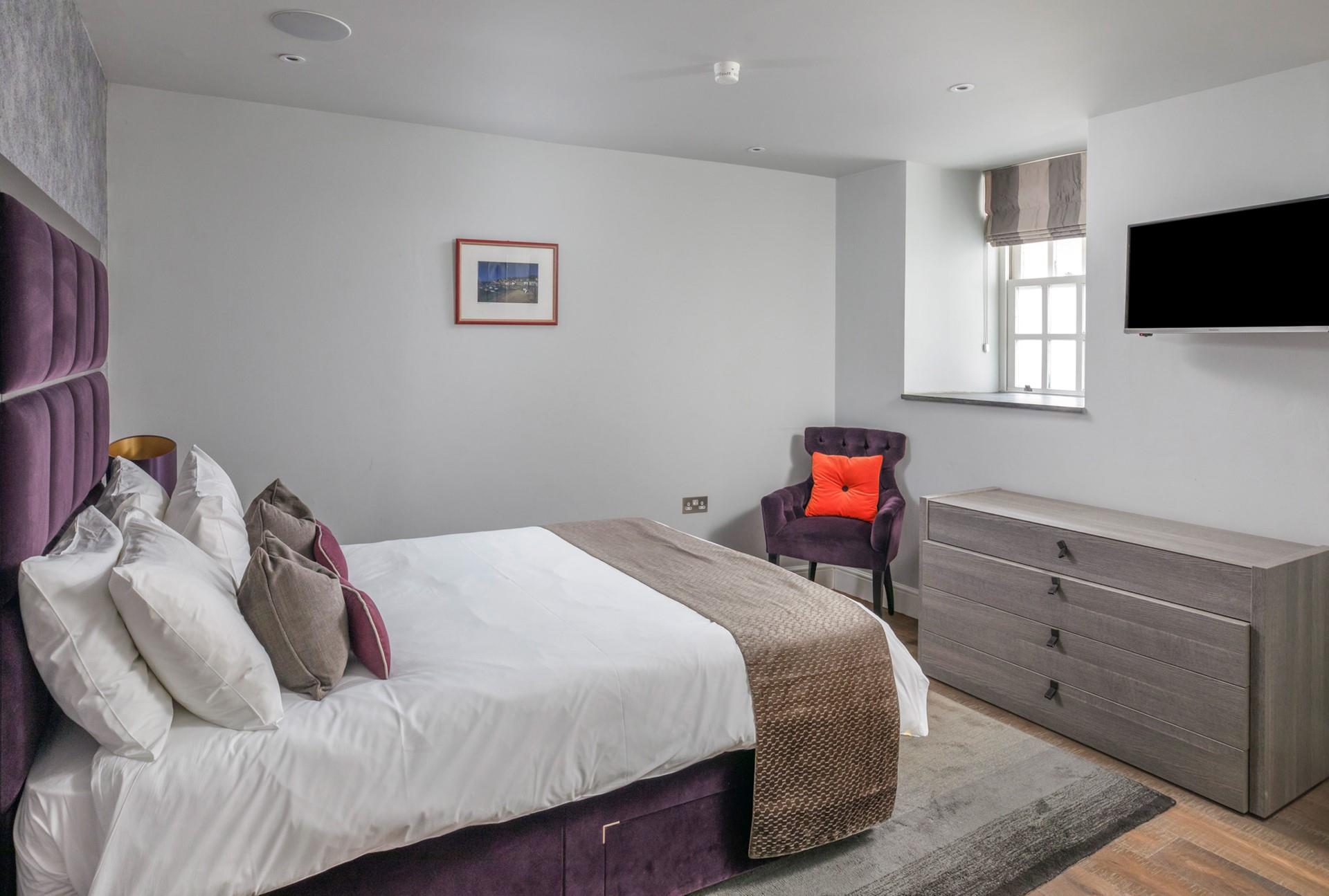 Enjoy a comfortable night's sleep in the king size bed.