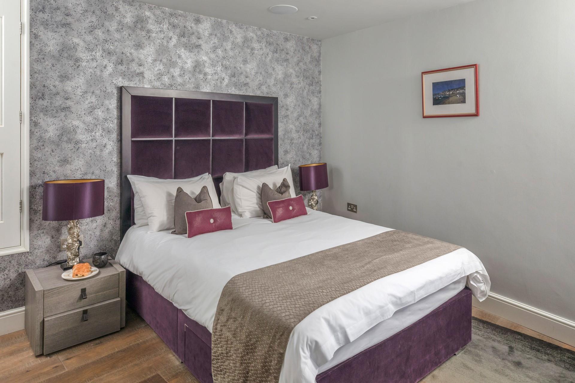 Wake up in the sumptuous bed before heading to the beach.