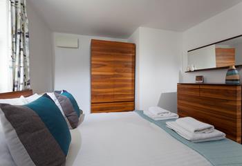 The double bedroom features lovely furniture to pack away your holiday clothes when you arrive.