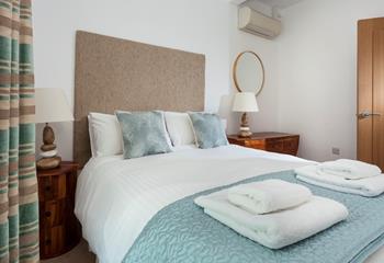 Sink into the spacious double bed and drift off for a peaceful night's sleep.