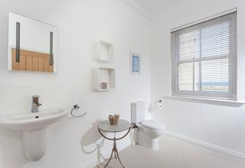 The spacious bathroom is the ideal place to get ready each morning.