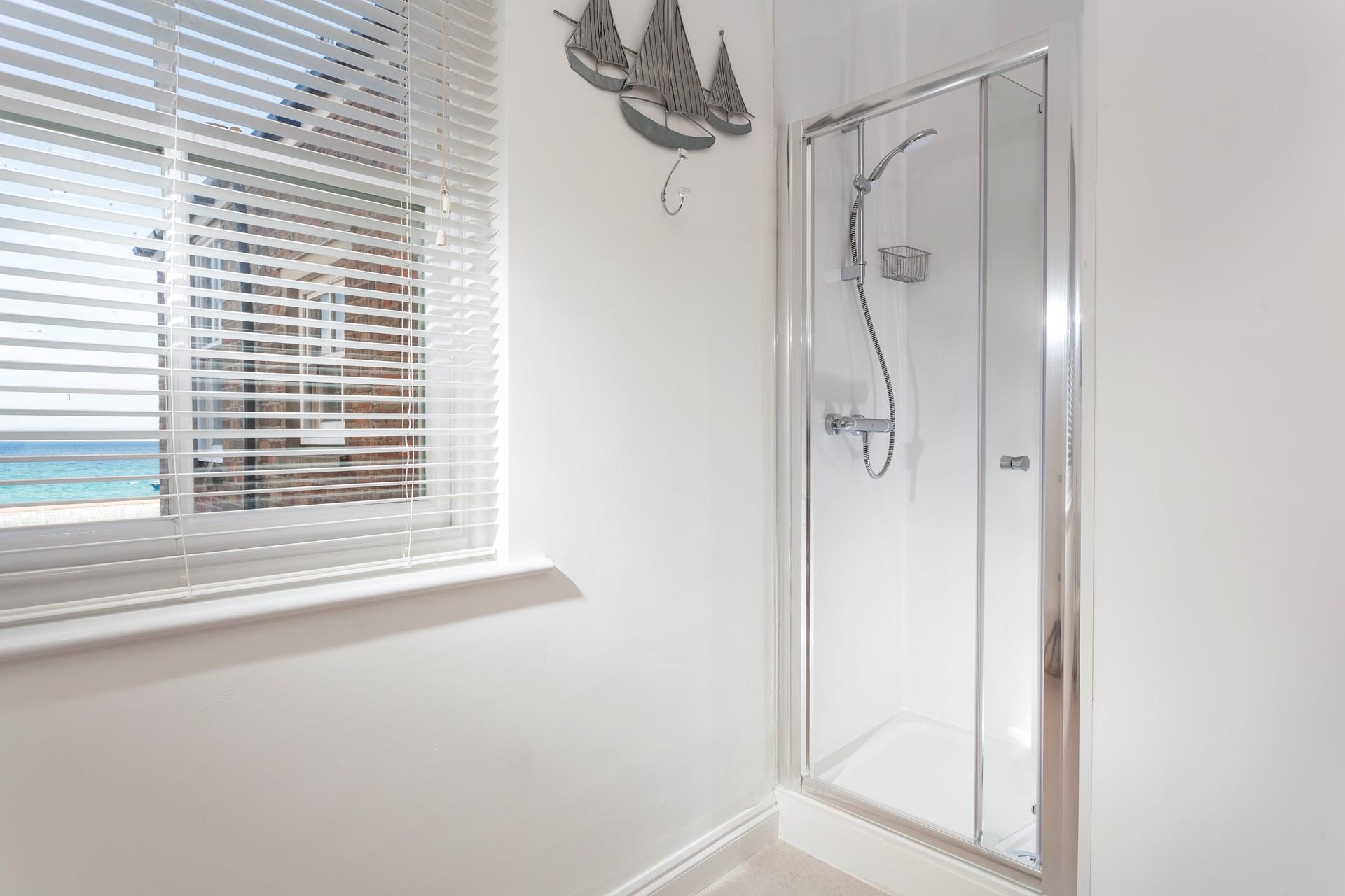 Wash off your sandy toes in the shower after a day on the beach.