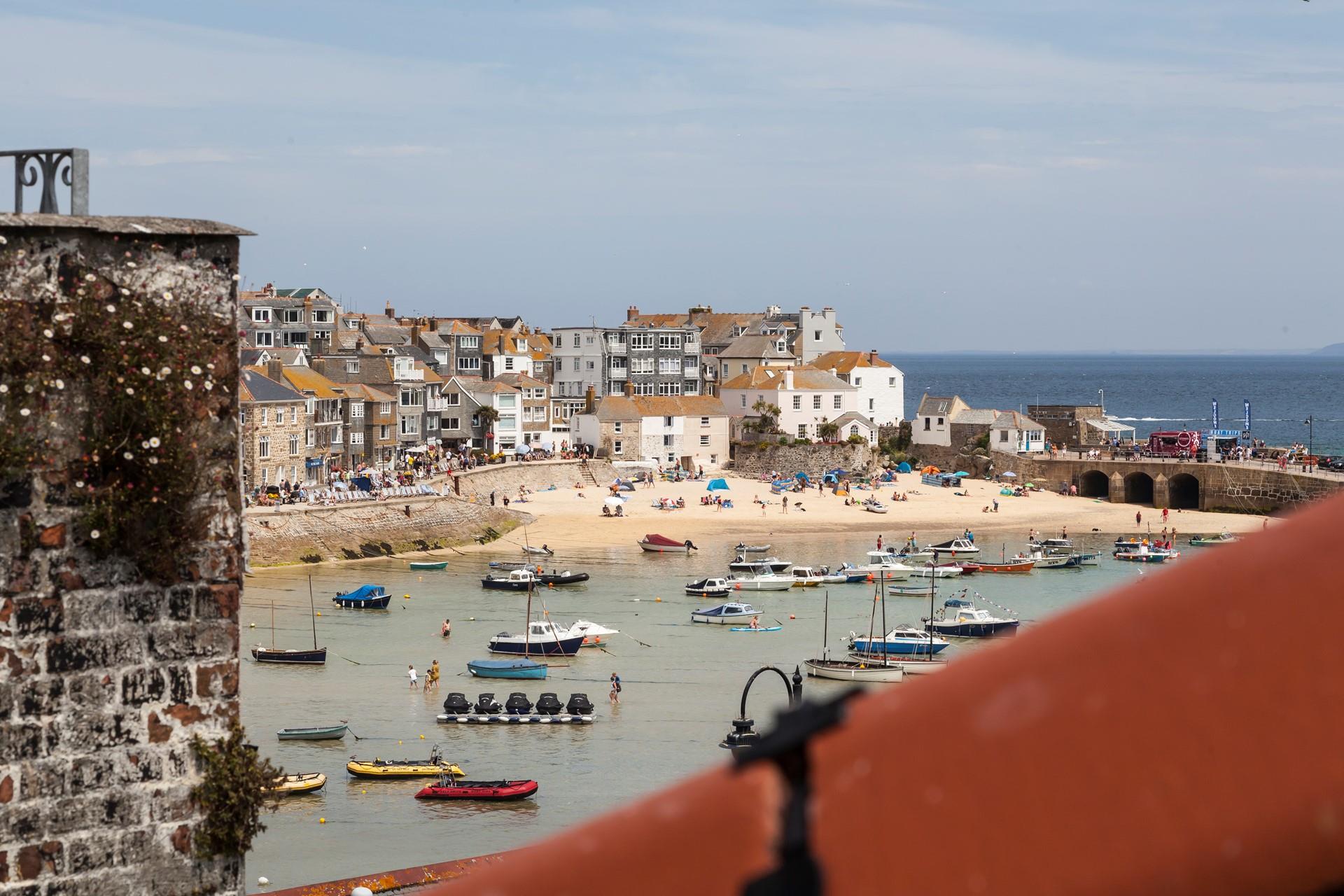 Watch the boats bobbing in the harbour.