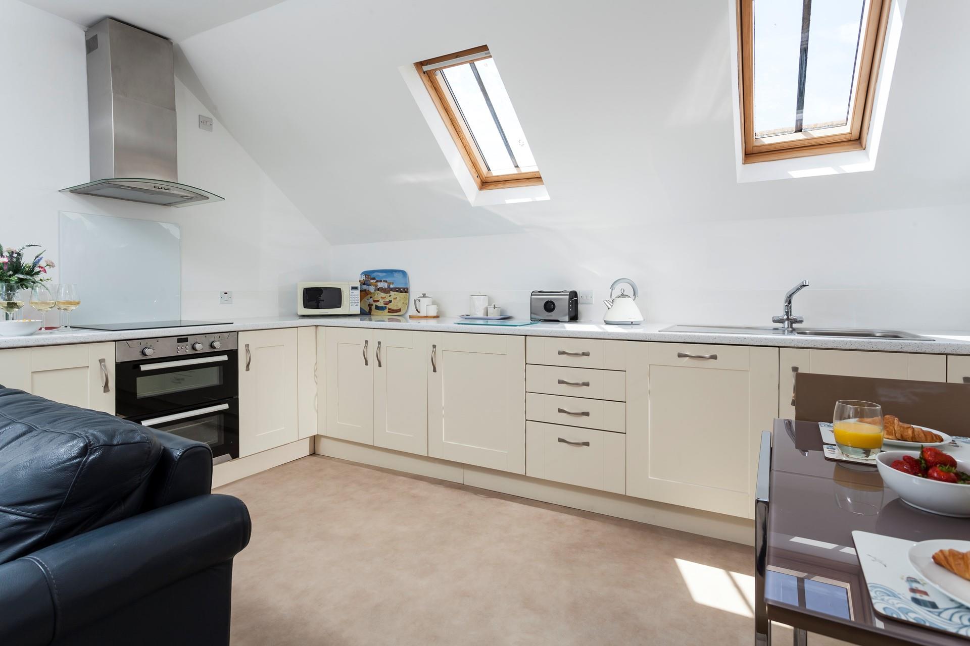 The spacious kitchen area has all you need to cook your favourite meal.
