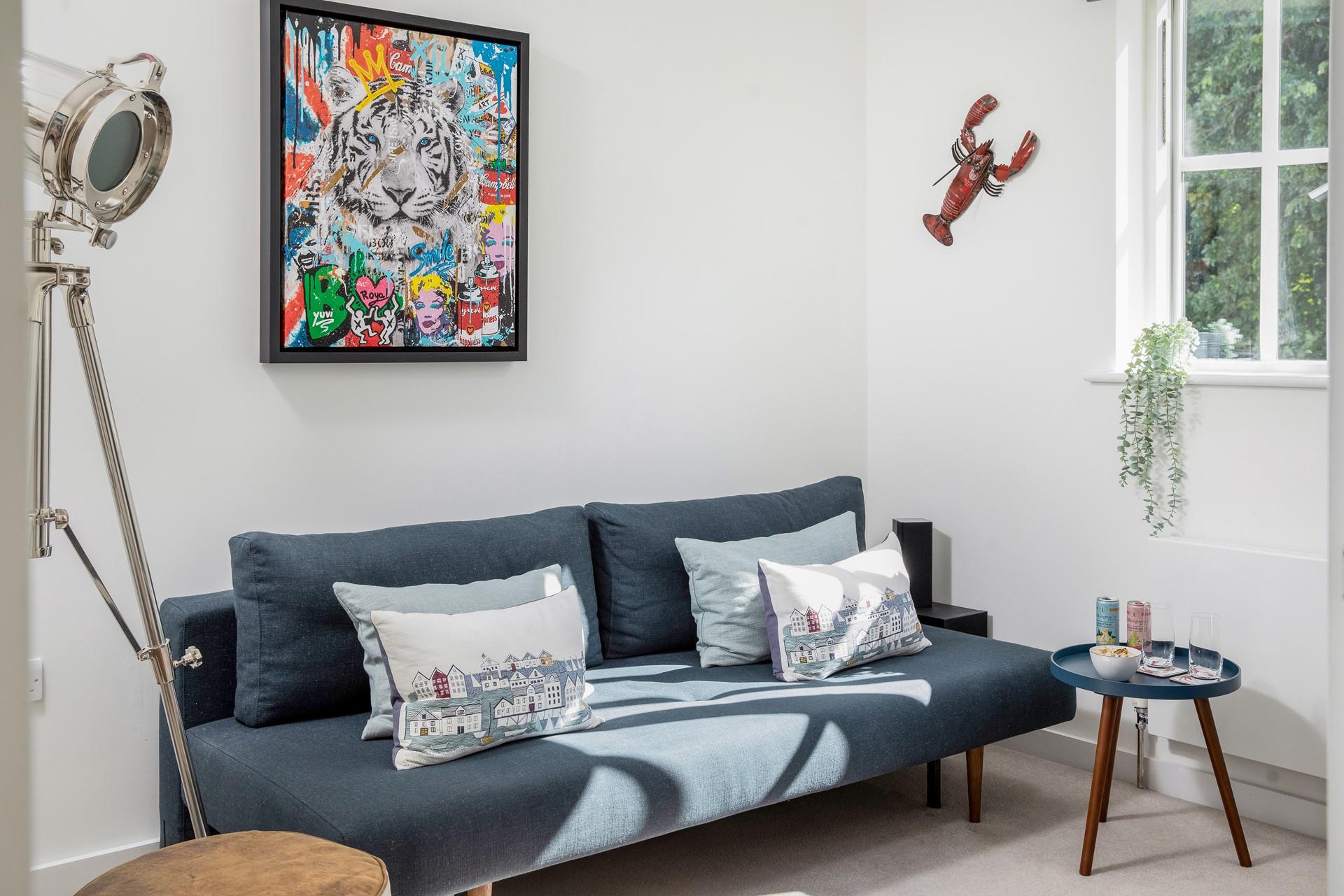 The snug has a selection of board games and a home cinema, perfect for movie nights.