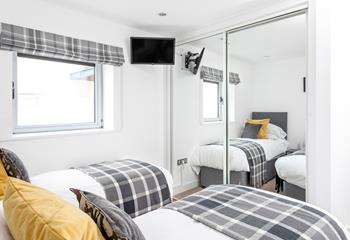 The delightful twin bedroom is perfect for adults or children.
