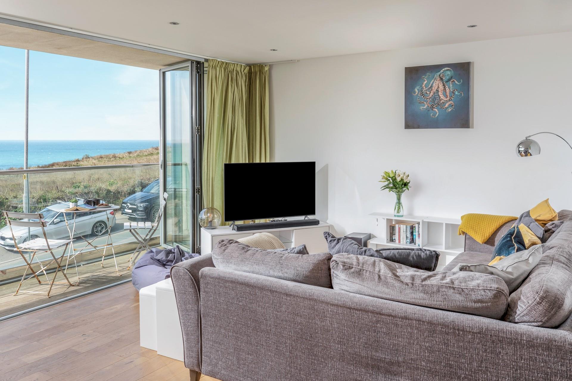 Sink into the sofa and enjoy a cosy evening with the beautiful view as a backdrop.