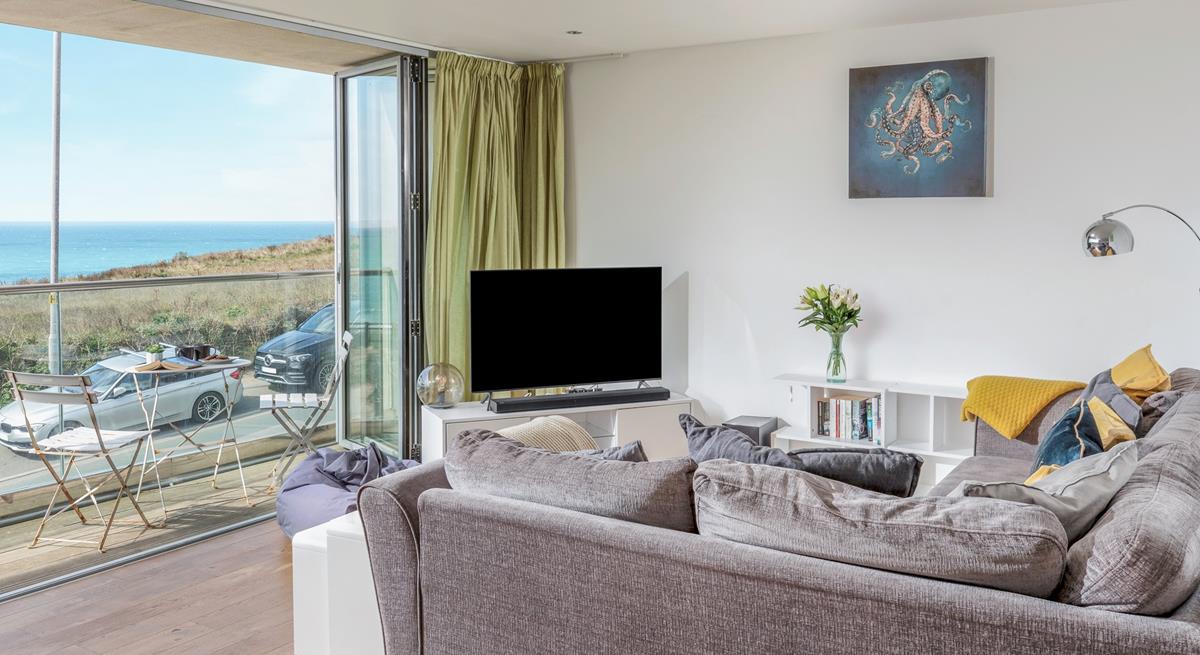 Sink into the sofa and enjoy a cosy evening with the beautiful view as a backdrop.