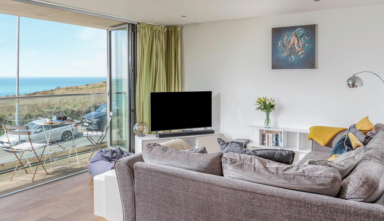 Sink into the sofa and enjoy a cosy evening with the beautiful view as a backdrop.