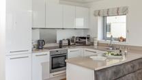 Cook up a storm in the well-equipped kitchen.