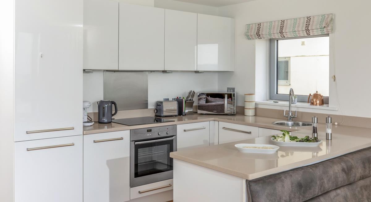 Cook up a storm in the well-equipped kitchen.