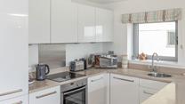 The stylish kitchen has all the amenities you need.