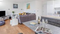 The open plan living area has plenty of space for all the family to relax together.