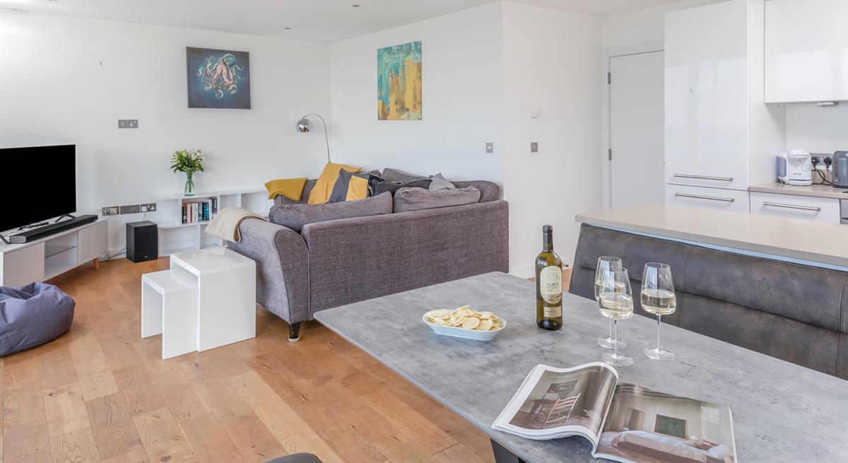 The open plan living area has plenty of space for all the family to relax together.