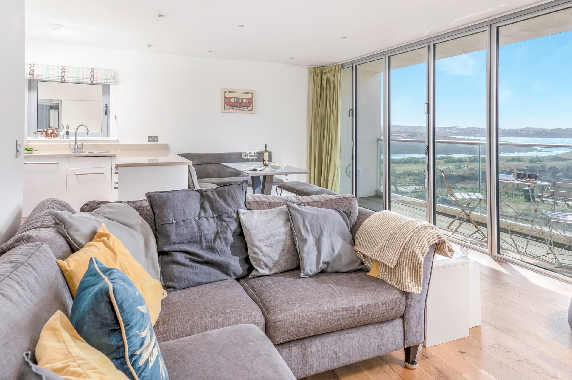 Enjoy the sea views from the sofa and dining table.