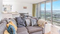 Enjoy the sea views from the sofa and dining table.
