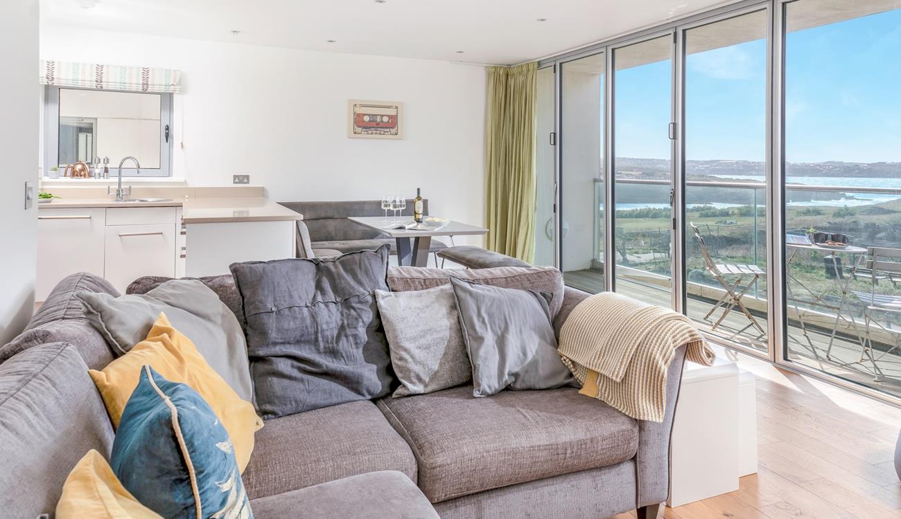 Enjoy the sea views from the sofa and dining table.