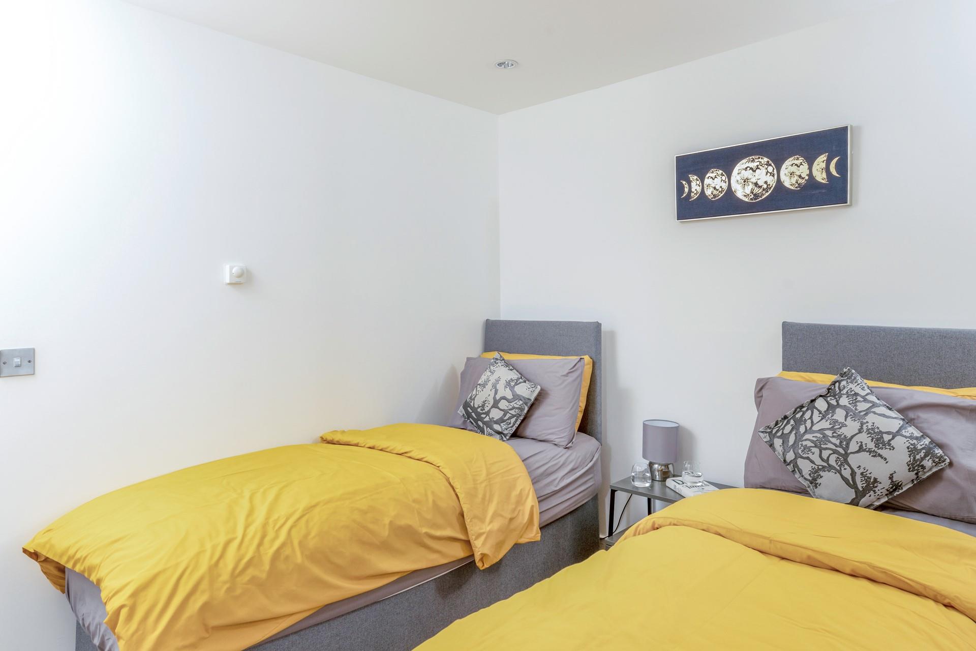 The delightful twin bedroom is perfect for adults or children.