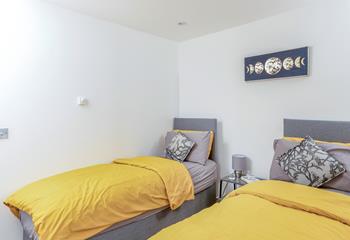 The delightful twin bedroom is perfect for adults or children.