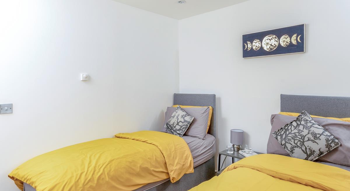 The delightful twin bedroom is perfect for adults or children.