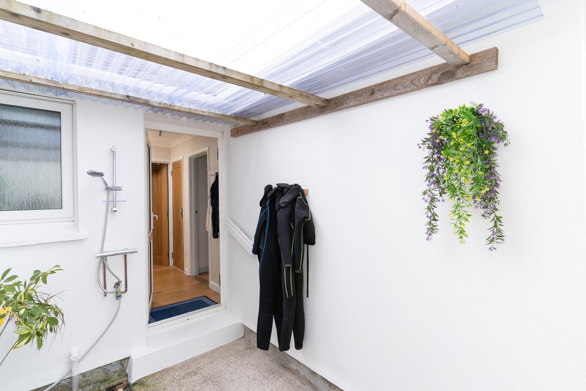 Wash off your sandy wetsuits all ready for your next surfing session. 