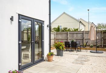 The enclosed garden is perfect for al fresco dining and a space for the children to play.