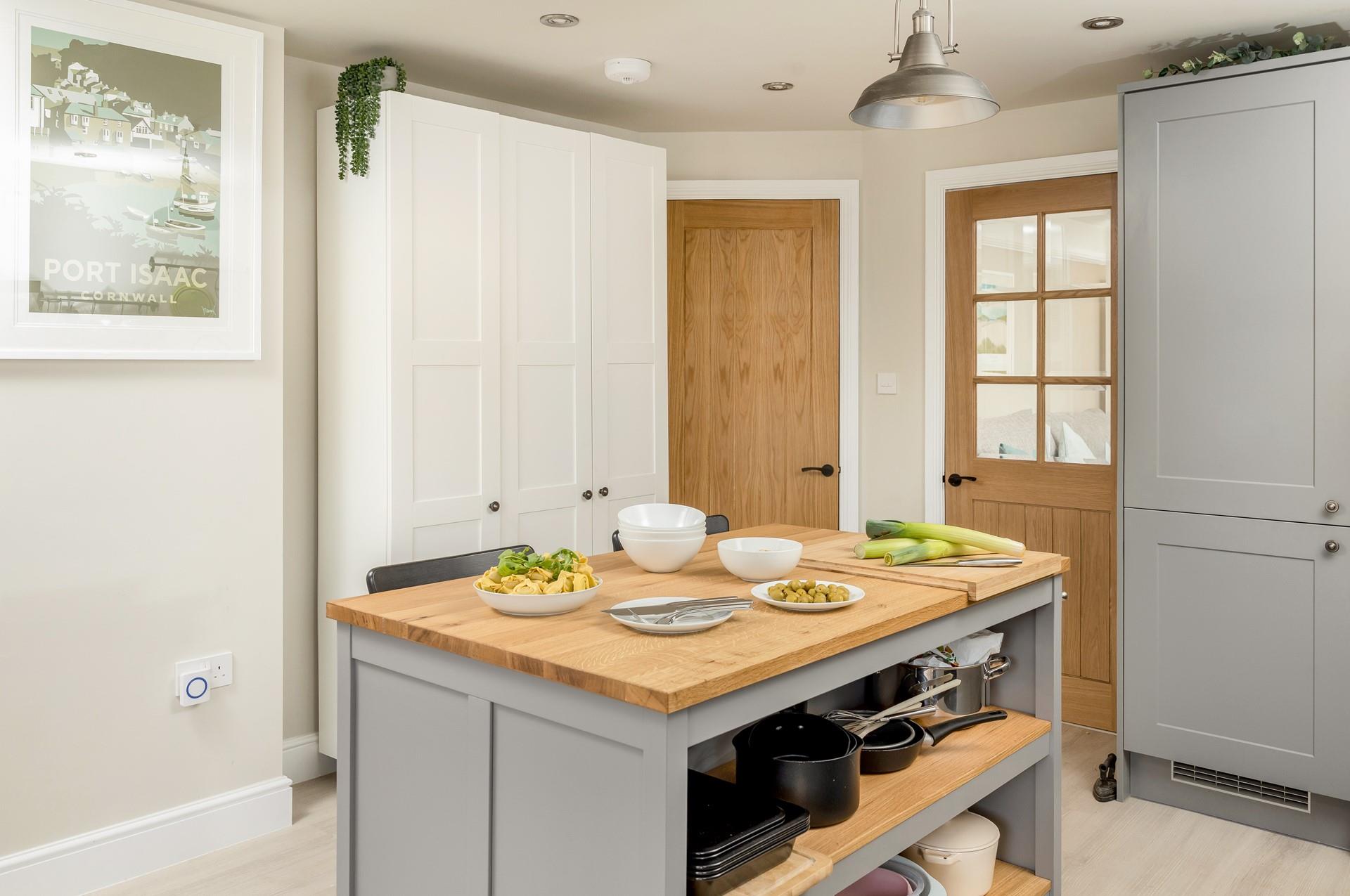 The kitchen has ample room for the chef of the family to prepare tasty meals.