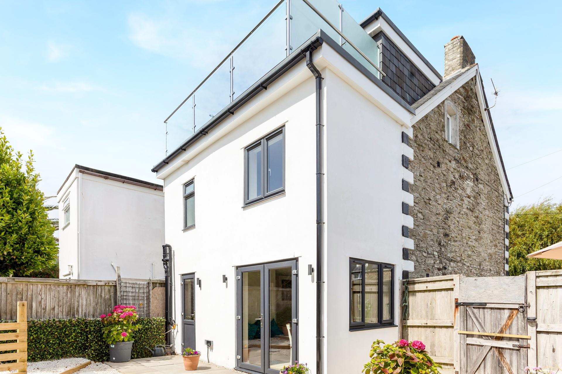 The balcony is the perfect place to watch the sun come down with a glass of something cold in hand.