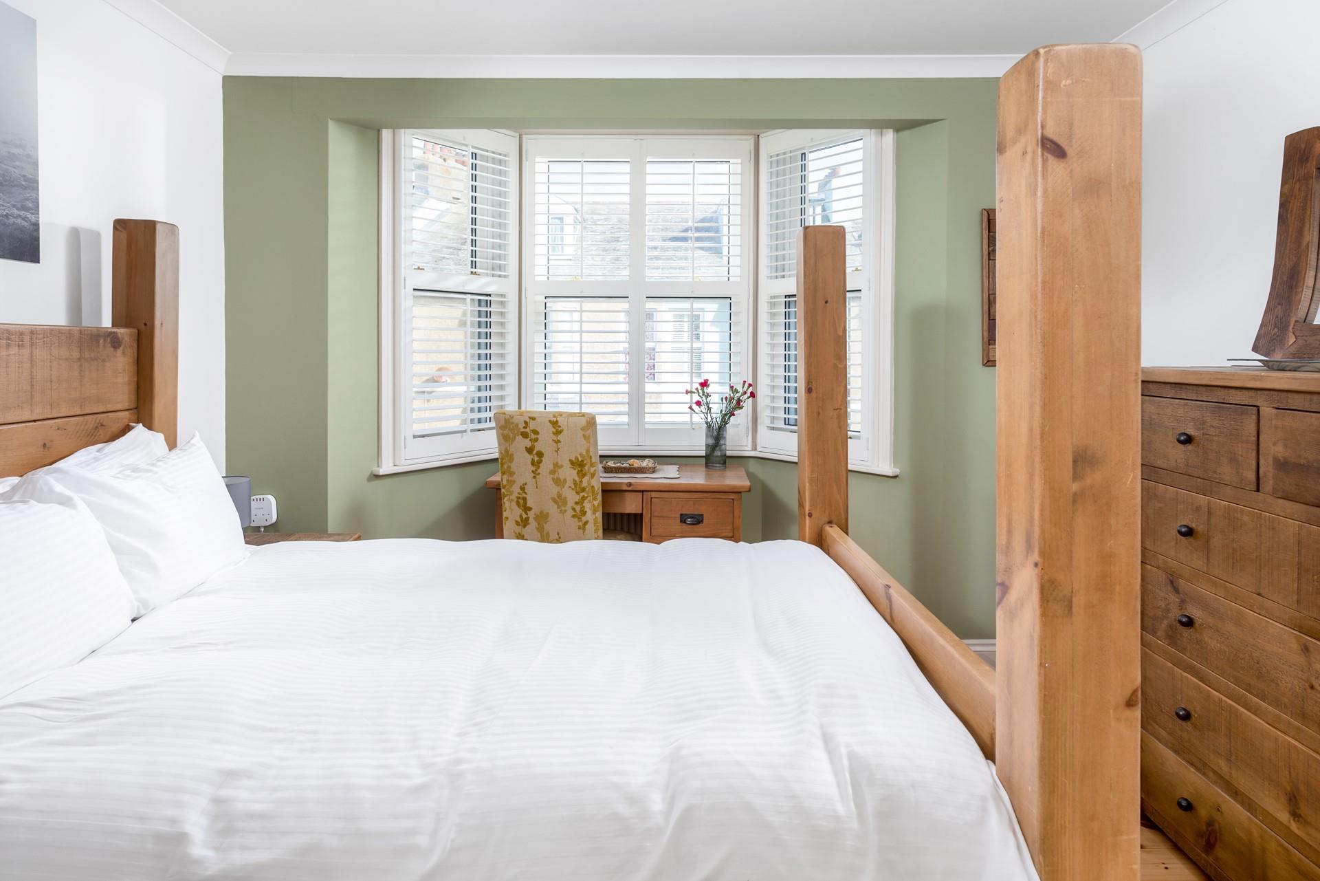 The spacious king size bed offers you a relaxing night's sleep.