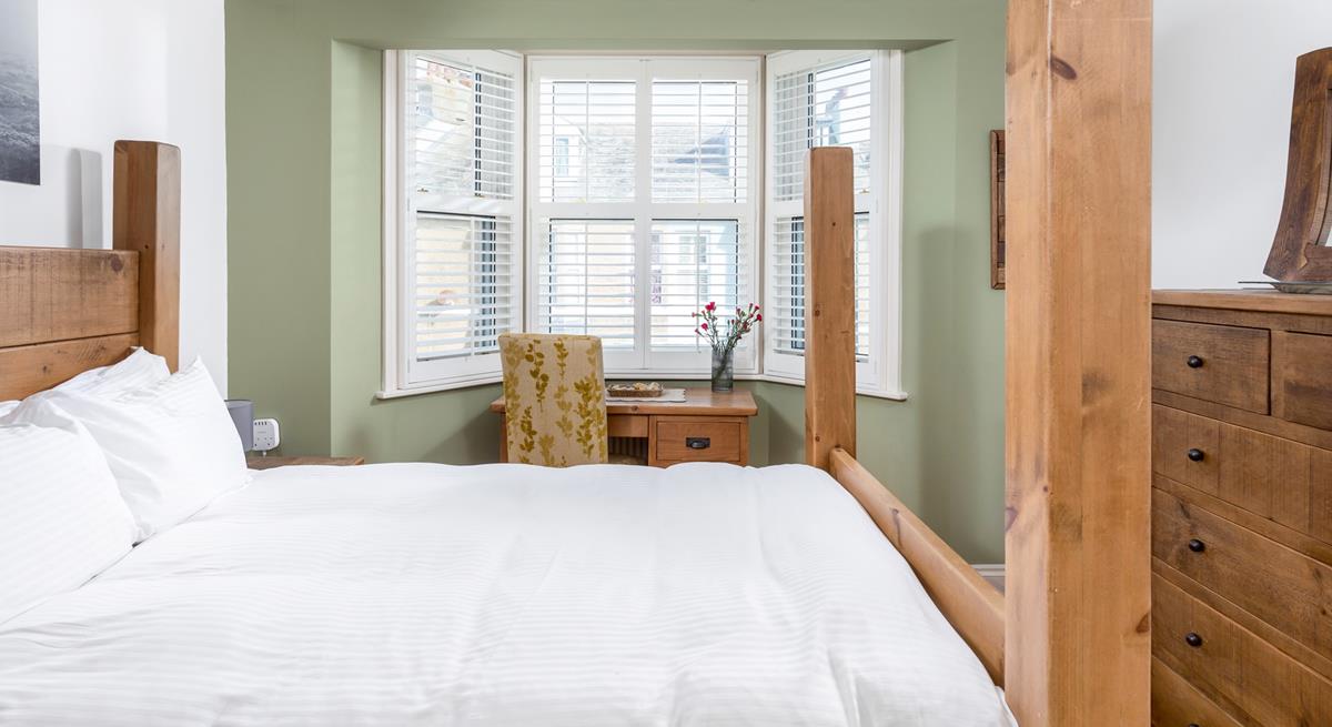 The spacious king size bed offers you a relaxing night's sleep.