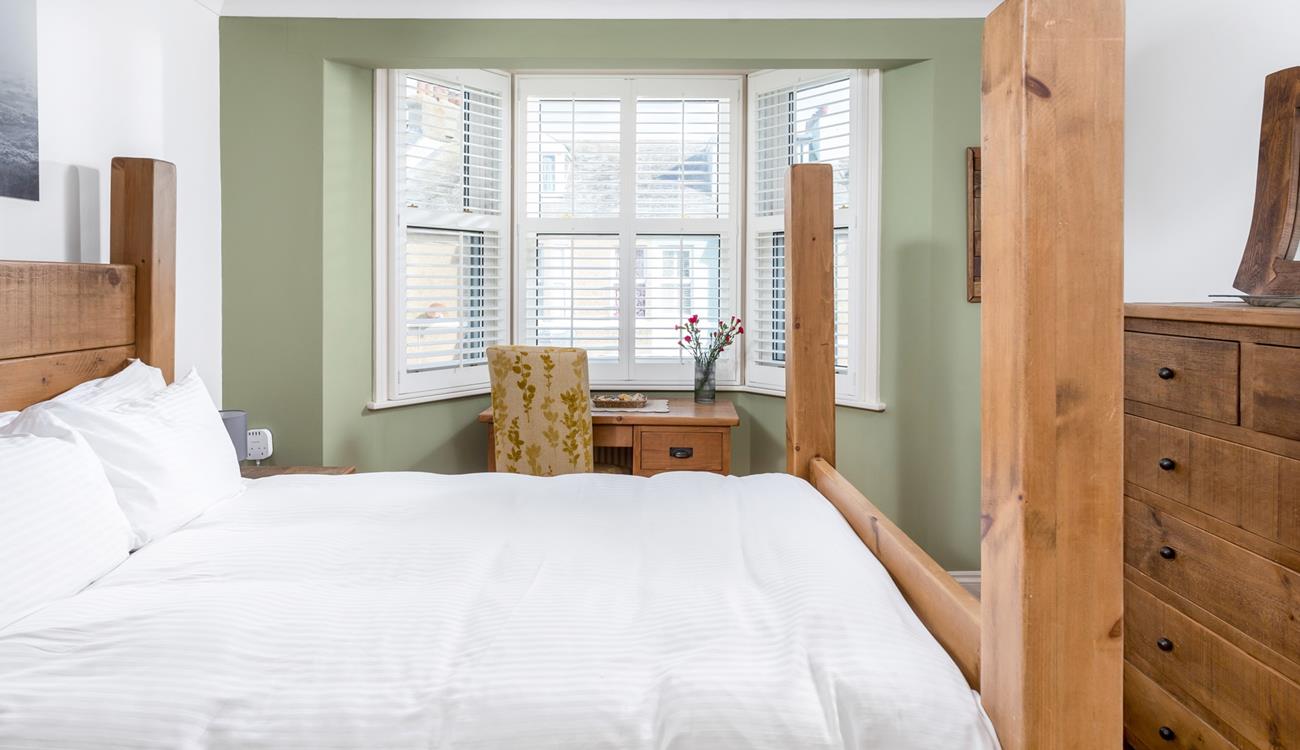 The spacious king size bed offers you a relaxing night's sleep.