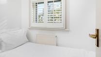 Bedroom 3 has a small single bed suitable for a little one.