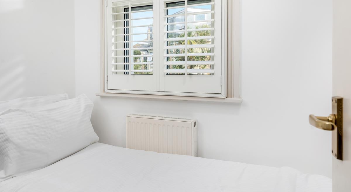 Bedroom 3 has a small single bed suitable for a little one.